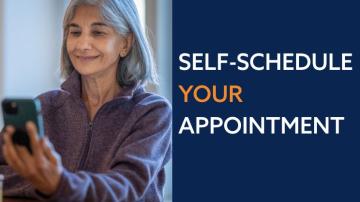 A woman holds a phone while text to her right reads "Self-Schedule Your Appointment" 