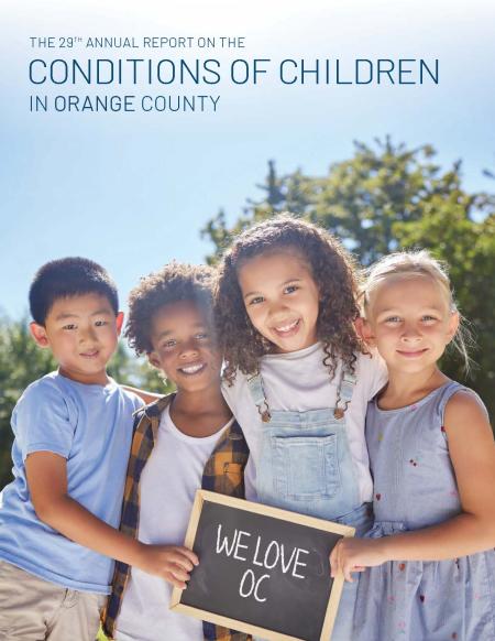 Cover of the 29th Conditions of Children Report featuring four children holding a chalkboard reading, "We love OC."